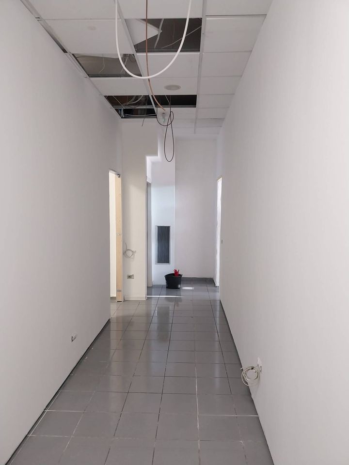 The same corridor with the walls finished and painted white